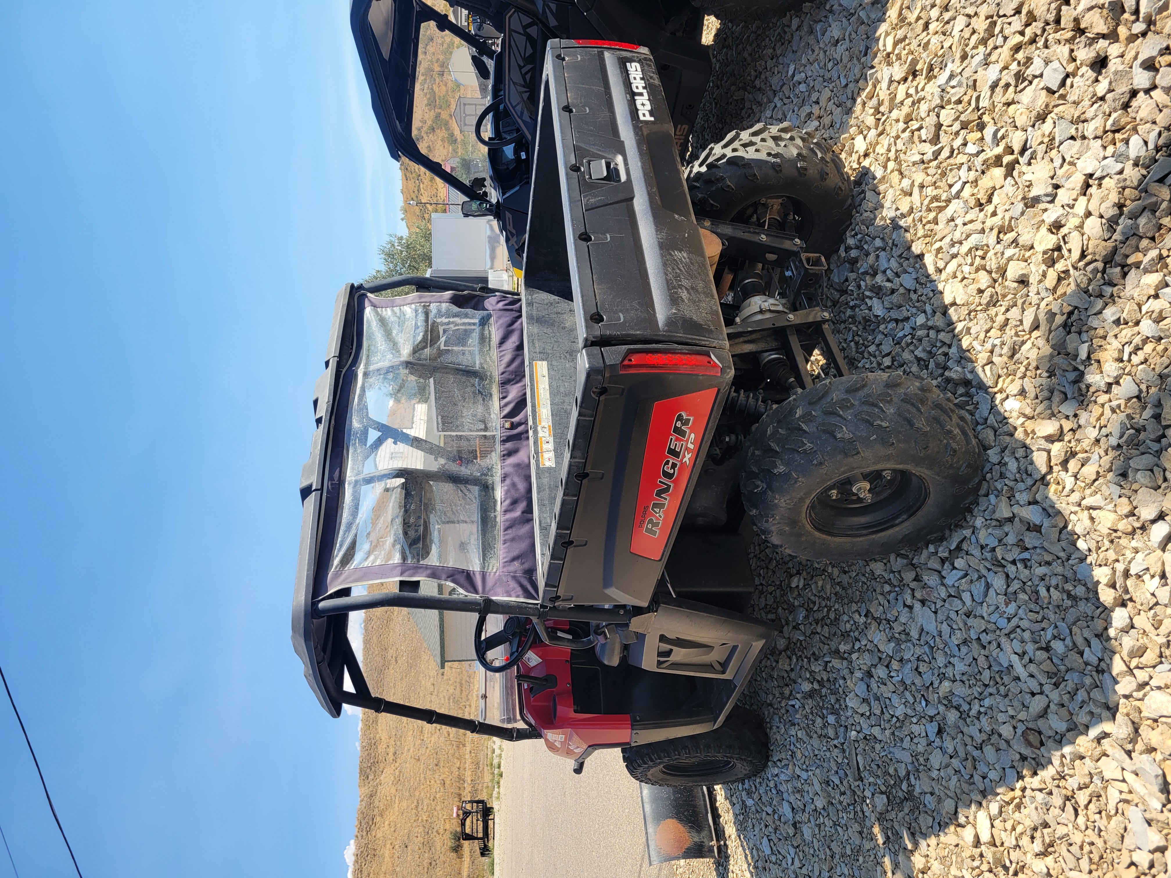 2009 POLARIS 4X4,700 EFI, SOLAR RED Utility